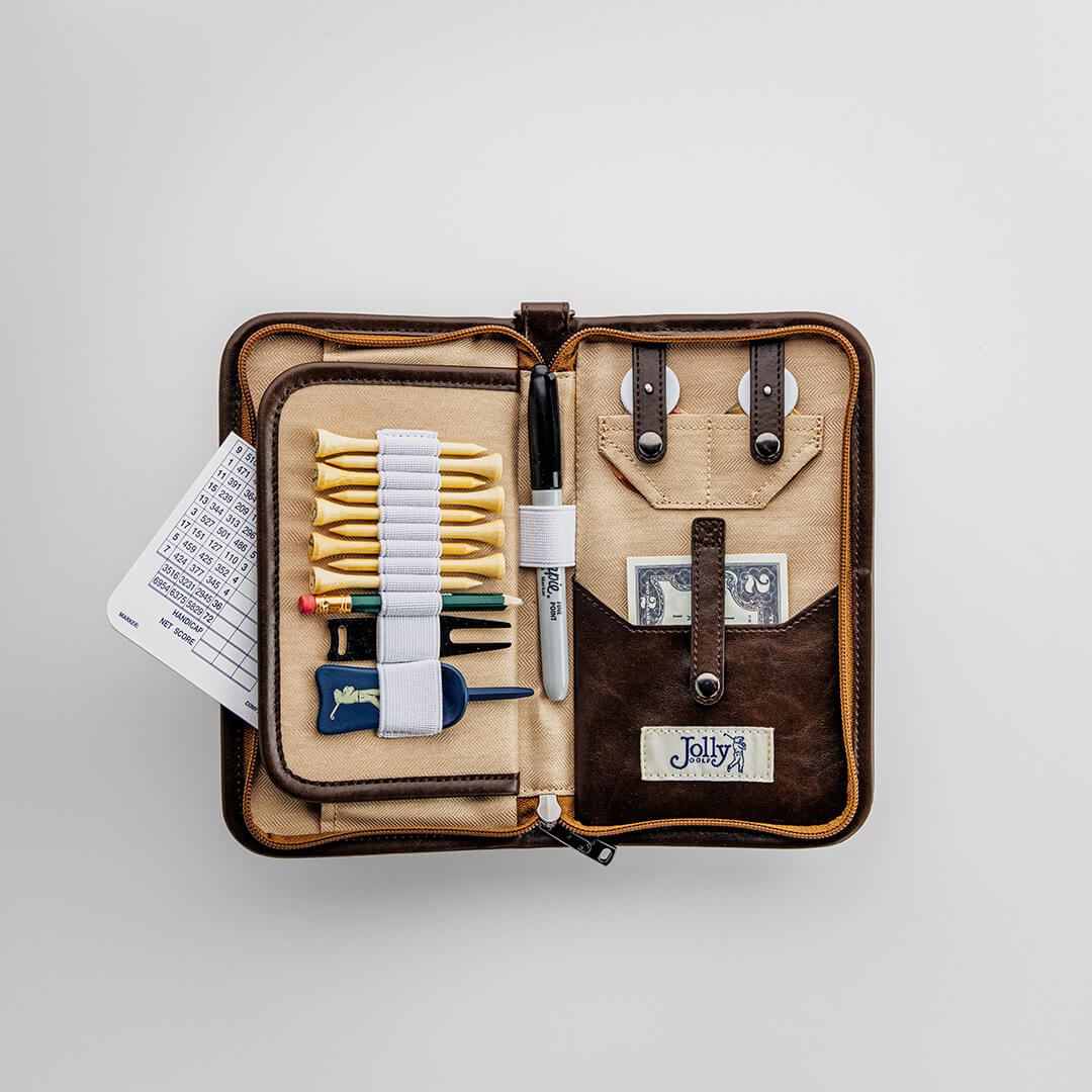 Jolly golf bag organizer pouch in brown waxed canvas shown open with leather trims and golf accessories