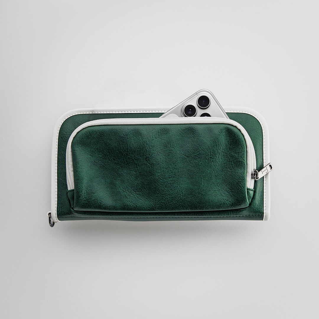 The Purist Vintage golf bag organizer pouch by Jolly Golf in green synthetic leather with a front phone pocket.