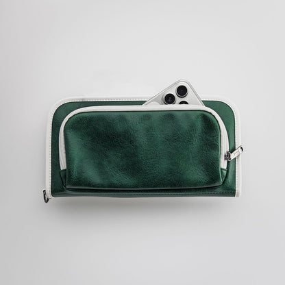 The Purist Vintage golf bag organizer pouch by Jolly Golf in green synthetic leather with a front phone pocket.