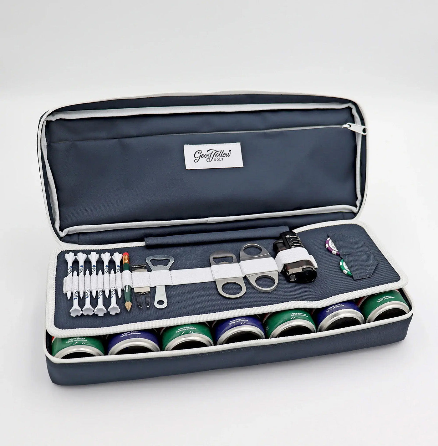 Navy Merrymaker golf organizer shown open with golf tees, pencil, ball markers divot tools, energy drinks and more inside