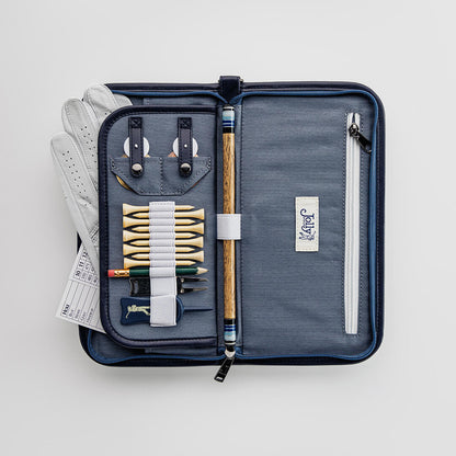 Golf organizer case by Jolly Golf with golf accessories including tees, glove, scorecard, ball markers, and divot tool.