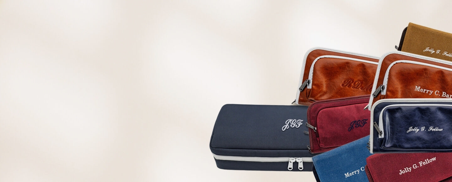 Collection of Jolly Golf leather and waxed canvas golf bag organizer pouches in different colors with personalized embroidery 