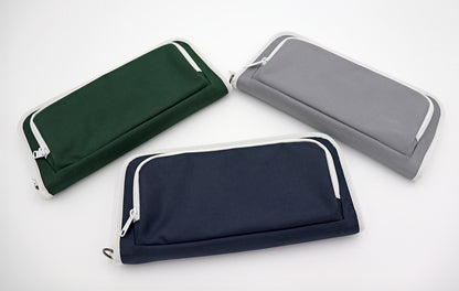 Three golf bag organizer pouches in green, navy, and gray on a white background