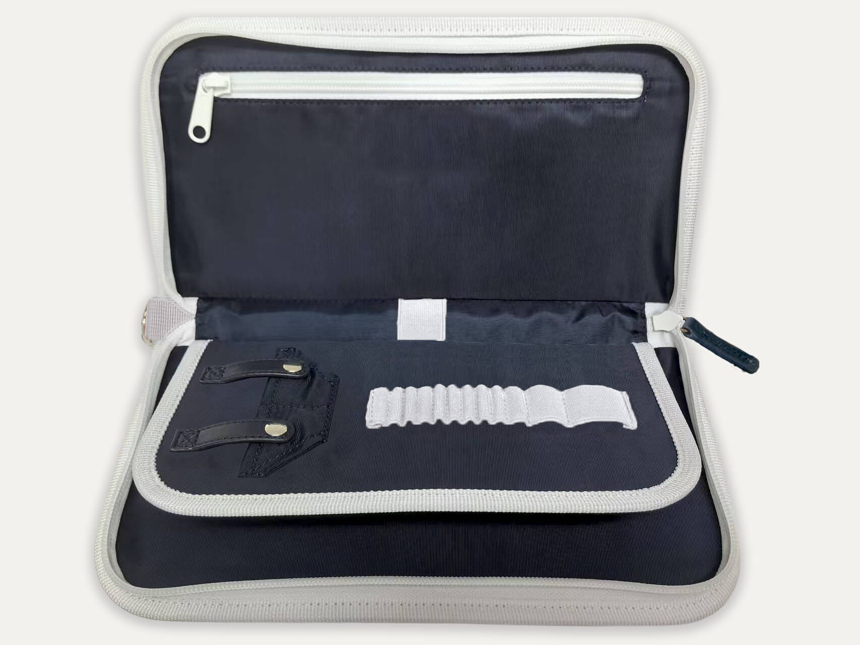 Product image of Jolly Golf’s latest release - the Purist Vintage Golf Bag Organizer, displayed open in navy blue with white trims.