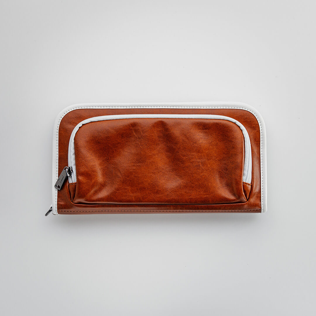 The Purist Vintage golf bag organizer pouch by Jolly Golf in brown synthetic leather.