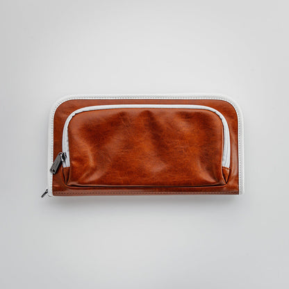 The Purist Vintage golf bag organizer pouch by Jolly Golf in brown synthetic leather.