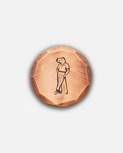 Bronze ball marker with Jolly capybara logo by Seamus Golf