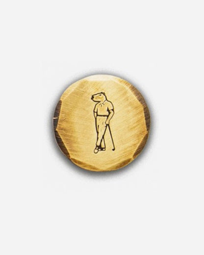 Gold ball marker with Jolly capybara logo by Seamus Golf